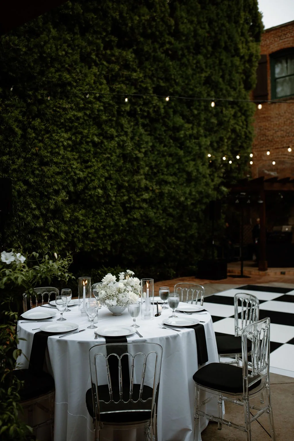 Black-tie patio wedding with round-table centerpieces