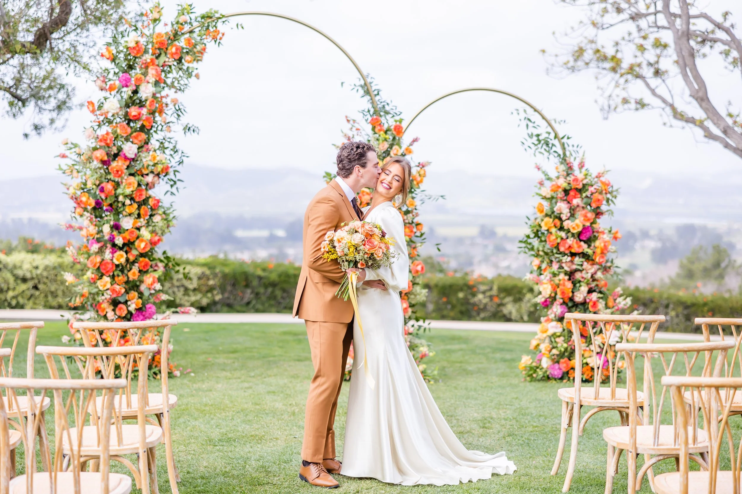 Lush romantic ceremony floral arch